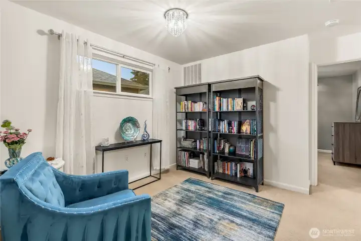 Versatile upstairs bonus area ideal for media, play, study, or a cozy second living space.