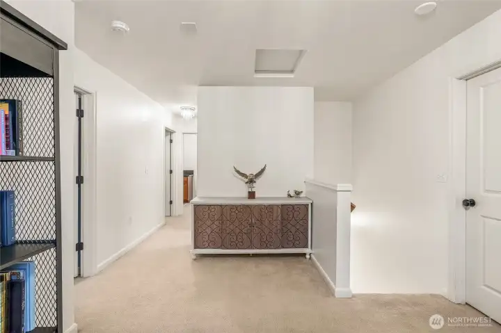 Upper hallway view connecting bedrooms with natural flow and light