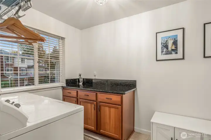 Laundry room with shelving and extra storage