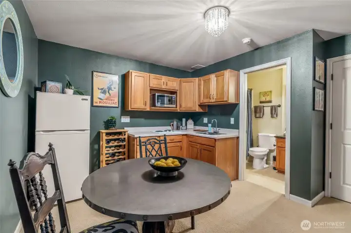 Alternate angle of lower kitchenette showing convenient layout adjoining the living area—perfect for morning coffee or easy entertaining.