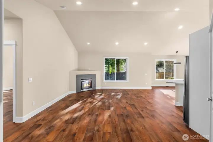 Bright great room with vaulted ceiling.