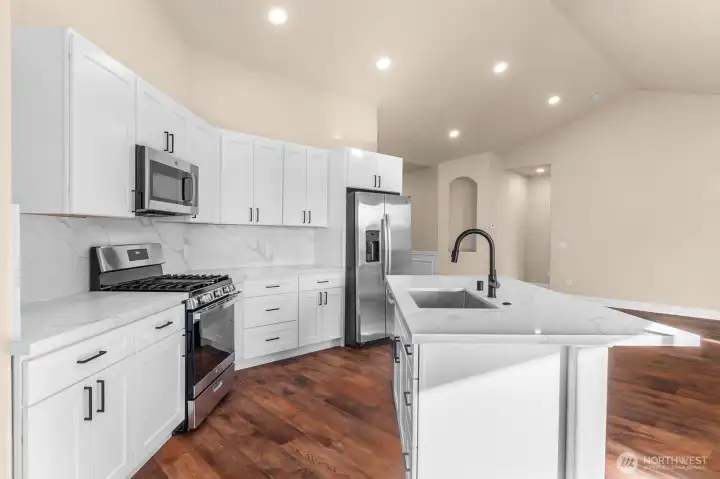 All NEW GE stainless steel appliances purchased & installed from McKinney's Appliance. Gas range, microwave hood, dishwasher and refrigerator.