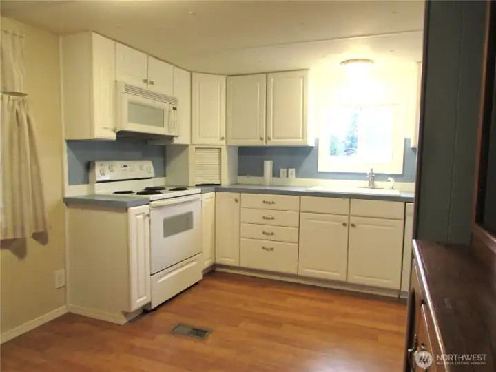 ALL UPDATED KITCHEN CABINETS AND APPLIANCES, LAMINATE FLOORING.