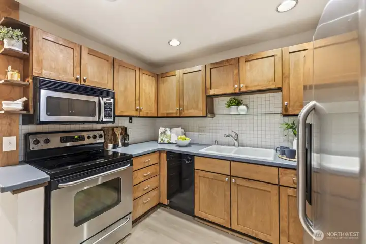 This kitchen is a joy to cook in! Stainless appliances and ample storage space will please any home chef.