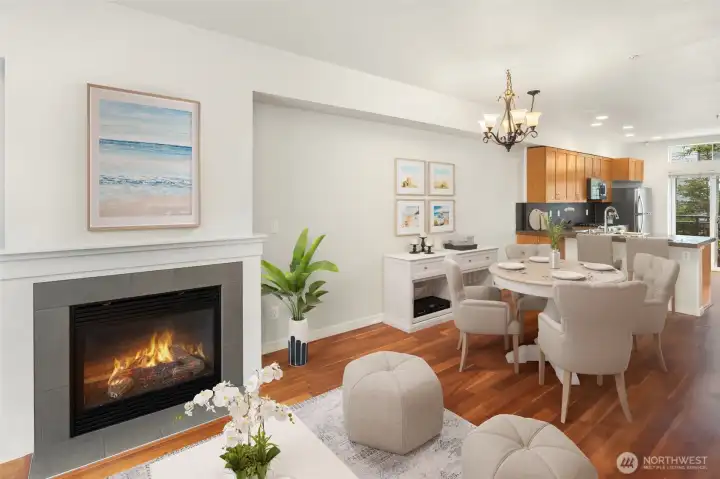 The main level offers an open great-room layout, seamlessly connecting the living and dining areas, powder room, and chef’s kitchen.