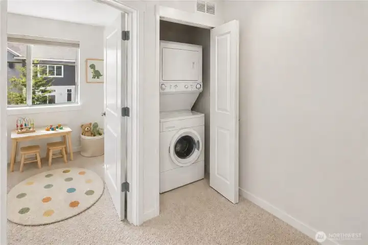 Laundry adjacent to 3rd bedroom at upper level