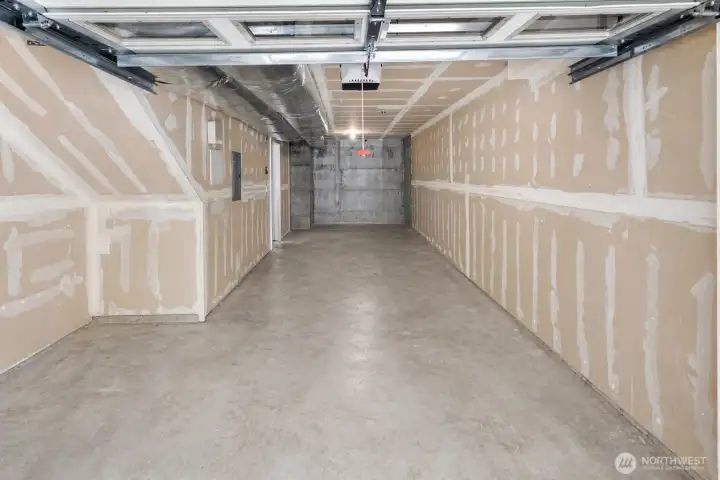 2-car garage with ample storage at lower level with entry on street level.