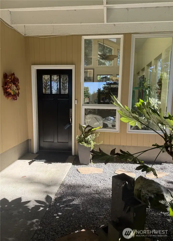 Sunroom is the main entrance to this home. Sunroom is the main entrance to this home.
