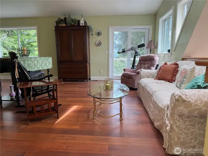 Upon entering the Primary bedroom, is a sitting area with a balcony through the sliding glass doors and skylight over the sitting area. Oceanview.