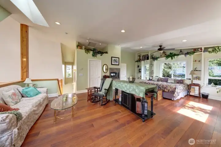 Primary Suite with propane fireplace seen from both bedroom and bath. Ocean view in bed or otherwise. Forest views as well. Ceiling fan. Primary Suite with propane fireplace seen from both bedroom and bath. Ocean view in bed or otherwise. Forest views as well. Ceiling fan.