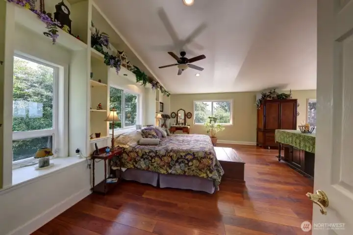32.  View from the Primary bath looking at the Primary bedroom facing south.