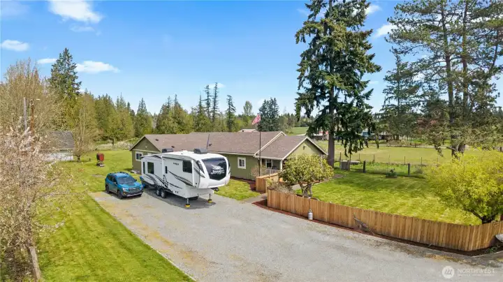 Long private driveway with ample parking for RVs, trailers, boats, or multiple vehicles—perfect for those needing space and flexibility.
