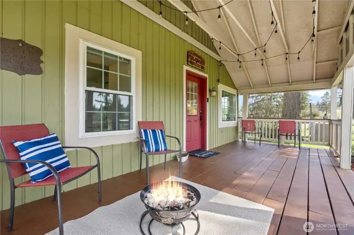 Front covered porch area adds additional outdoor living space, perfect for relaxing evenings or hosting guests.