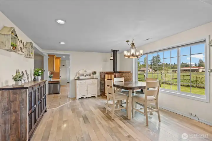 Bright open-concept kitchen and dining area filled with natural light, featuring a functional layout ideal for everyday living and entertaining.