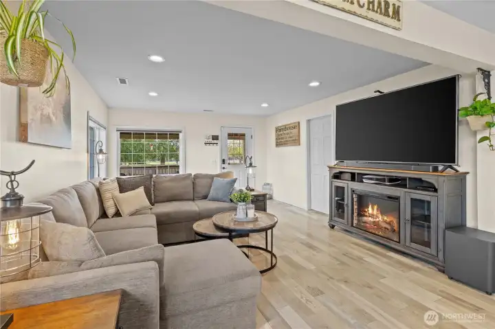 Inviting living area featuring a cozy fireplace, creating a warm focal point and comfortable gathering space year-round.