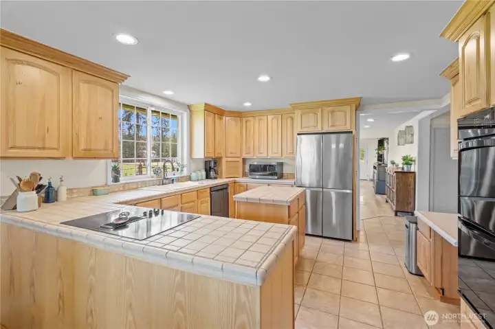 Kitchen with center island providing additional workspace and casual seating—great for meal prep and gatherings.