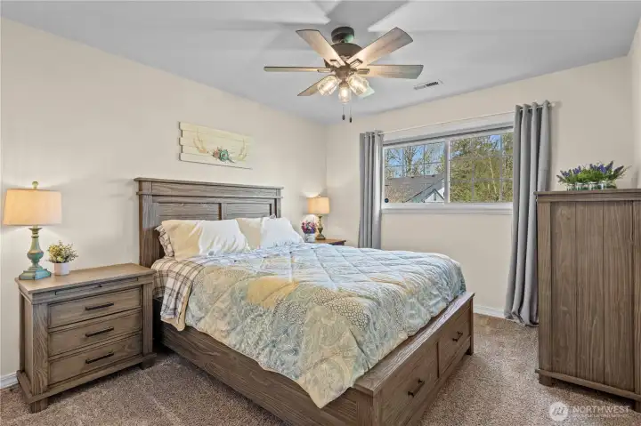 Spacious bedroom with ample closet space and peaceful views of the surrounding acreage.
