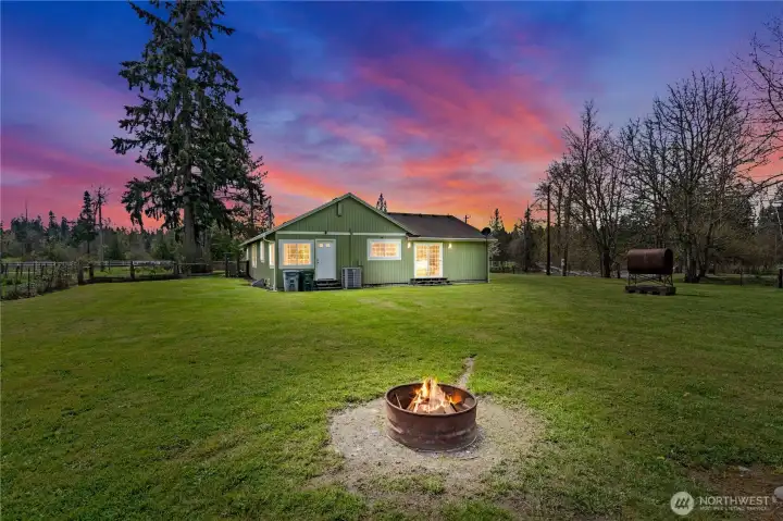 Beautiful sunset view showcasing the peaceful setting and natural beauty of this private acreage property.