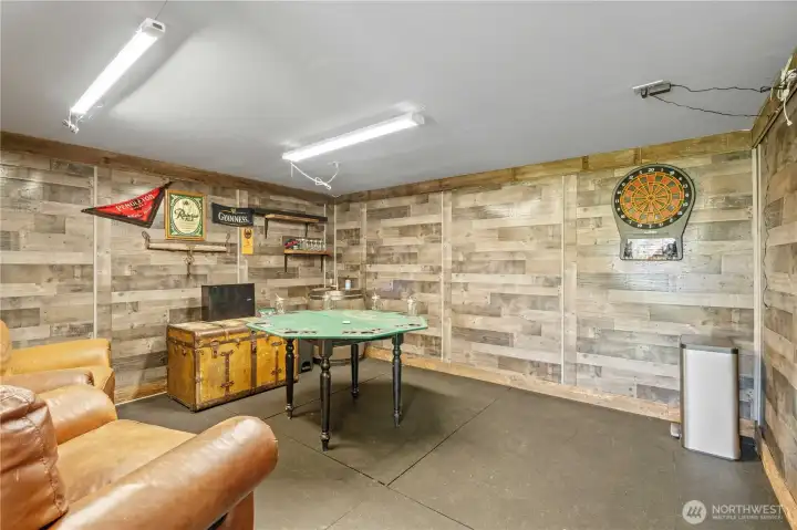 Finished shop/man cave interior—ideal for projects, workspace, recreational use, or equipment storage.
