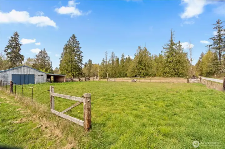 Expansive fenced acreage providing security and flexibility for hobby farming, animals, or recreation.