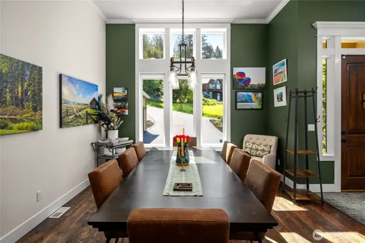 Custom millwork crown molding in the open dining room to allow for oversized dining table with plenty of space.