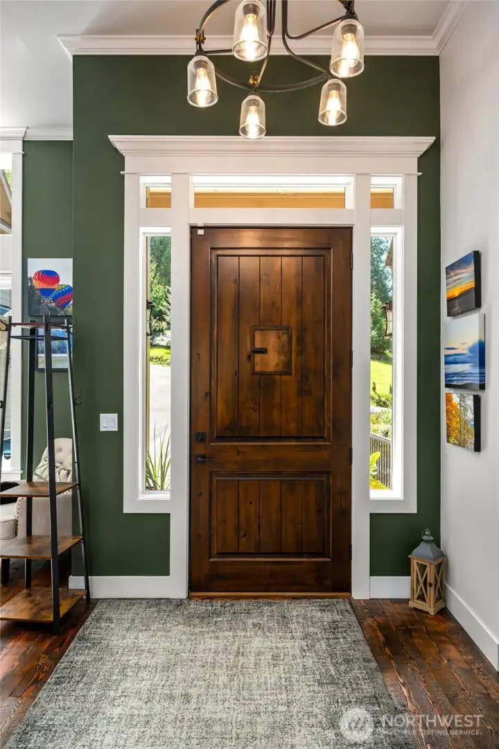 8' tall oversized main door with fully wrapped custom crown millwork.