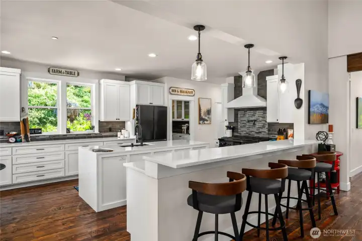 Oversized Chef's kitchen with over $40,000 upgraded appliances, wine fridge and more.