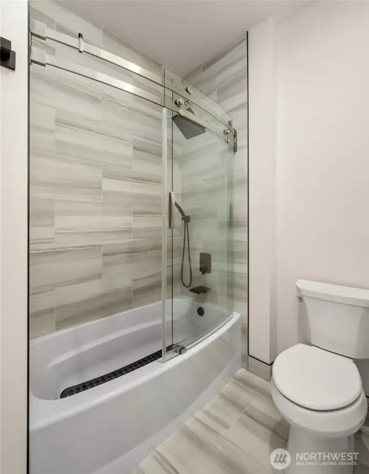 Basement suites both contain full en-suite bathrooms with floor-to-ceiling porcelain tile.