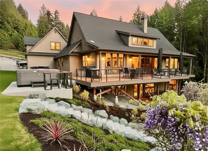 Beautiful backyard for entertaining w/ blooming Wisteria, multi-level decks, curved staircases, hot tub with built-in bar and mountainside garden beds. Beautiful backyard for entertaining w/ blooming Wisteria, multi-level decks, curved staircases, hot tub with built-in bar and mountainside garden beds.