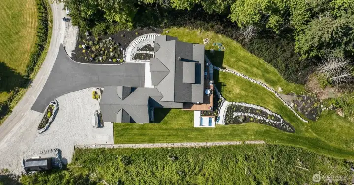 Large lower acre is cleared to maximize sun exposure and outdoor recreation.