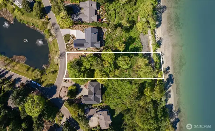 A shy 1-acre site with 101' of waterfront