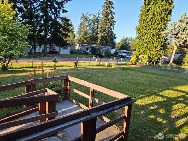 view of front yard from deck