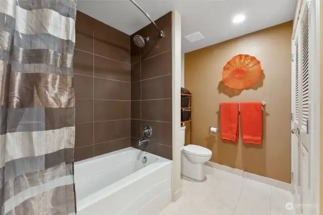 The six foot soaking tub is also a combination shower. Ceramic tiles surrounding the tub are classic and easy to maintain.