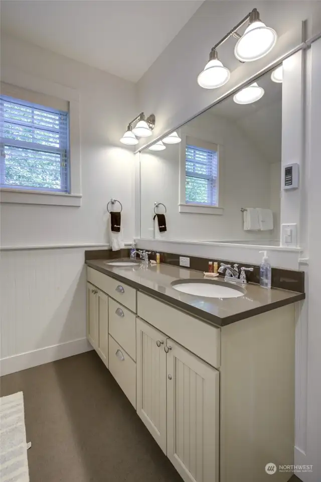 The primary bath is oversized with double sinks and built in vanity...