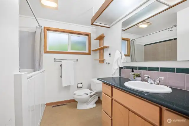The main floor full bath has a ADA compliant walk-in Koehler bath tub (about $30,000), and a large vanity.