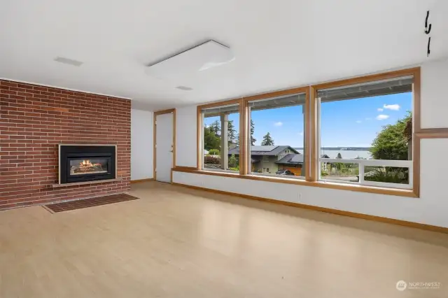 The lower family room even has stunning views and floor to ceiling windows. There is access from the driveway through this door should you wish to make this a separate living area.