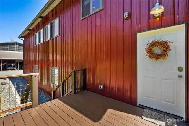 Deck and front door for the apartment/additional dwelling unit.