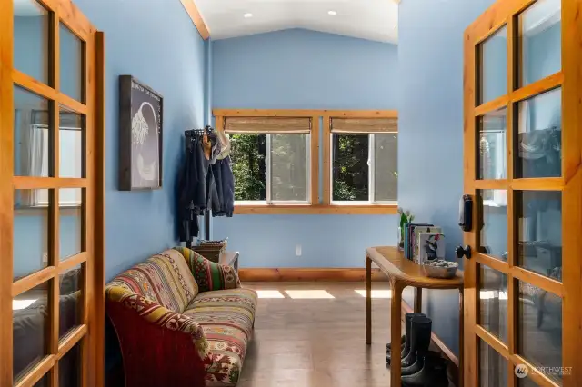 Apartment foyer with French doors.