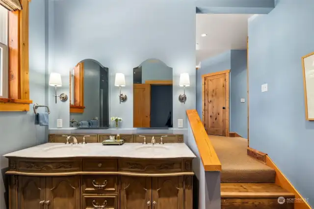 ADU/apartment bath with double sinks and tiled shower.