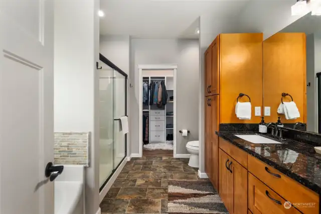 Primary bedroom en suite bath with shower, tub and walk in closet.