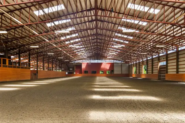 200 x 100 fully enclosed riding arena topped with sand, geo textile footing and MAG footing.