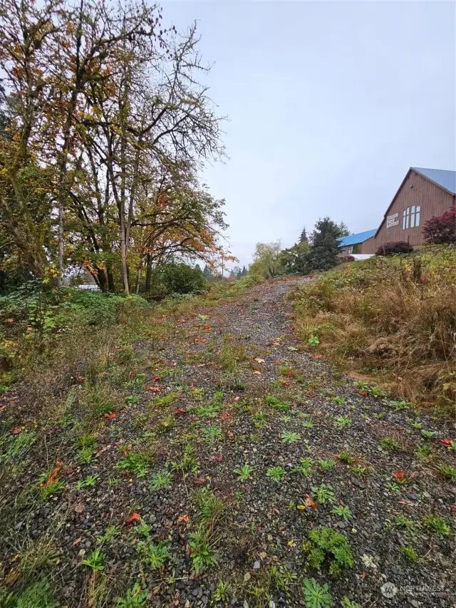 Property tucks below road and hidden away.