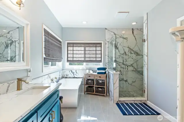 The Primary bathroom is luxurious and ready for your spa day or just your start to a new day.  Heated floors, walk-in shower, stand alone tub, double sink vanity, private water closet. Meticulous attention to details and craftsmanship.  Meant to be enjoyed!