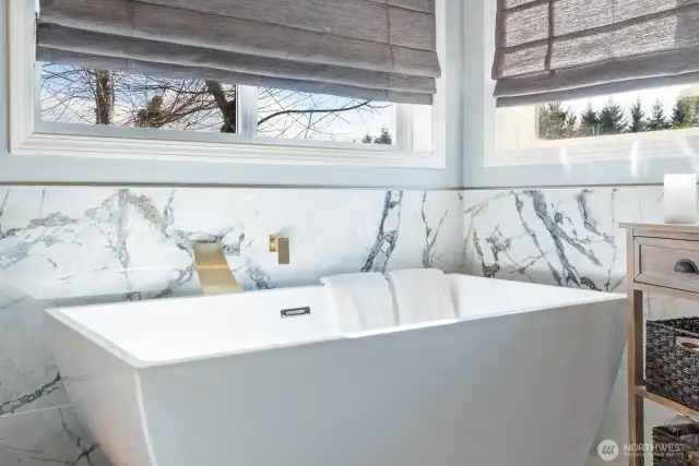 Bath detail with plenty of ambient light and privacy shades. Designed for relaxation!