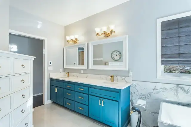 This well-designed primary bathroom feels like a private retreat.  This is a blend of luxury, functionality, and relaxation. This space has a clear, well-thought-out flow between the vanity, shower, bathtub, and water closet (enclosed toilet area) for privacy.  So polished and sassy! (Easy to maintain too!)