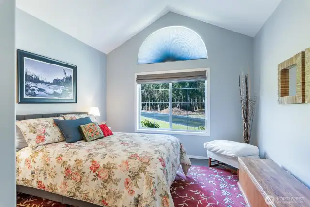 Bedroom #2 facing front of the home, clean lines vaulted ceiling.