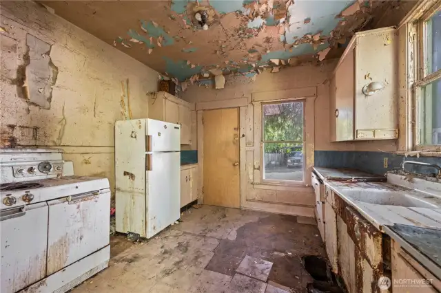 There is damage to every ceiling, wall, and floor in every room of the home.