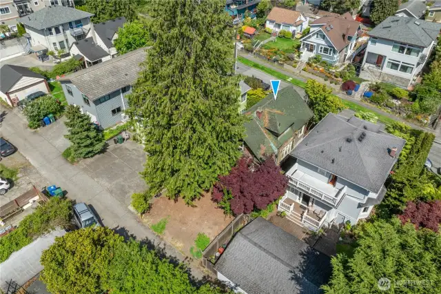 Behind the home is an alley way that provides access to the level backyard.