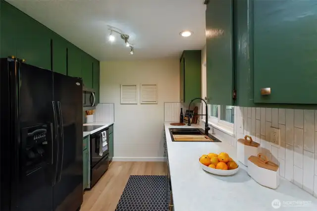 Kitchen updated with new counters, backsplash and sink