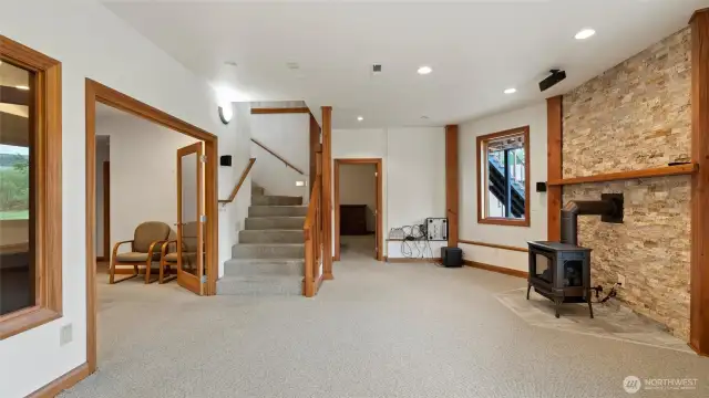 Lower level open living/family room, French doors to Office